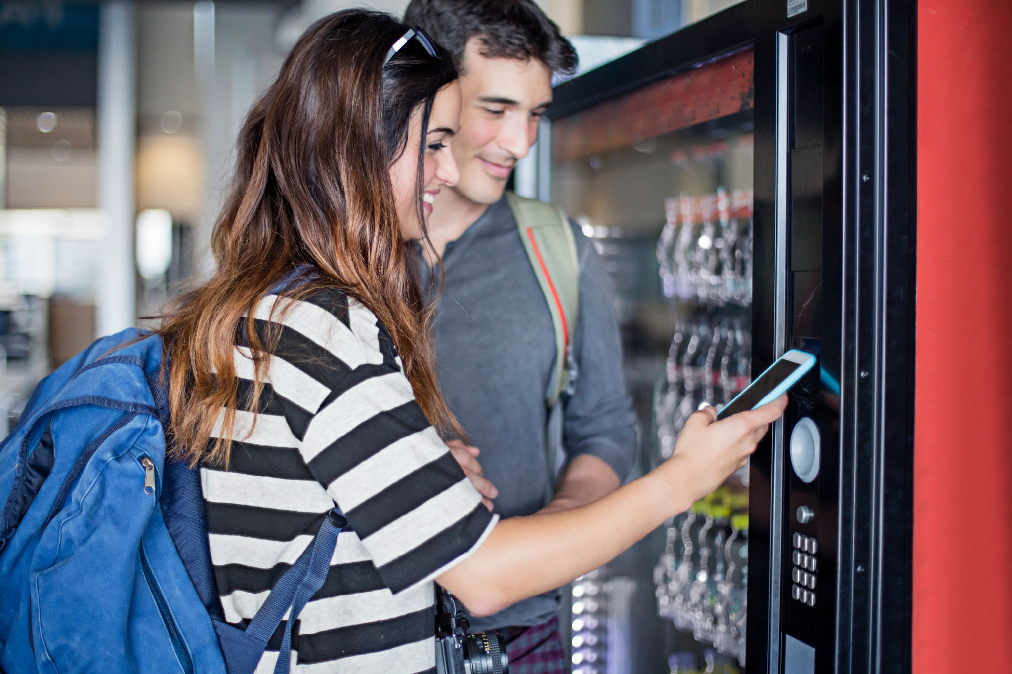 Colorful selection of healthy snacks and beverages in a vending machine