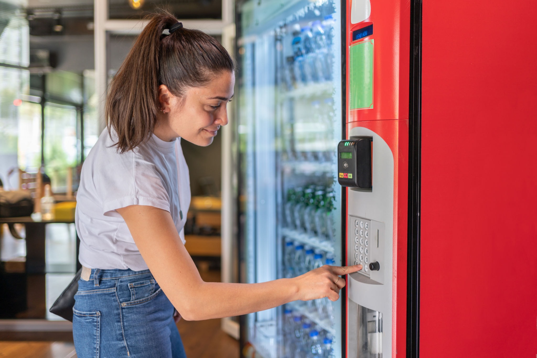 Colorful selection of healthy snacks and beverages in a vending machine