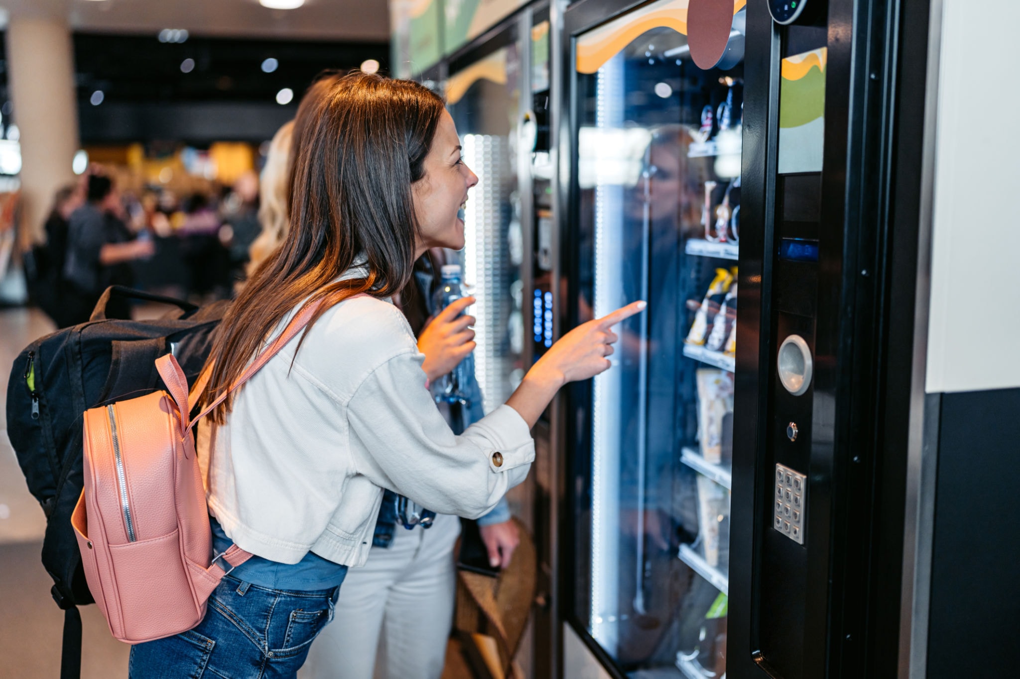 Colorful selection of healthy snacks and beverages in a vending machine